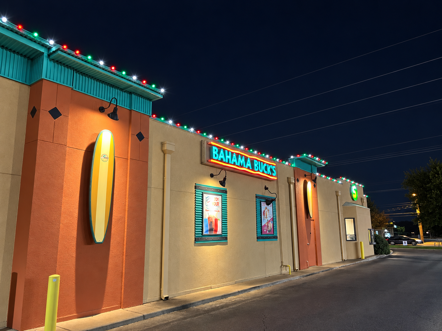 Office building exterior with Christmas lighting at dusk