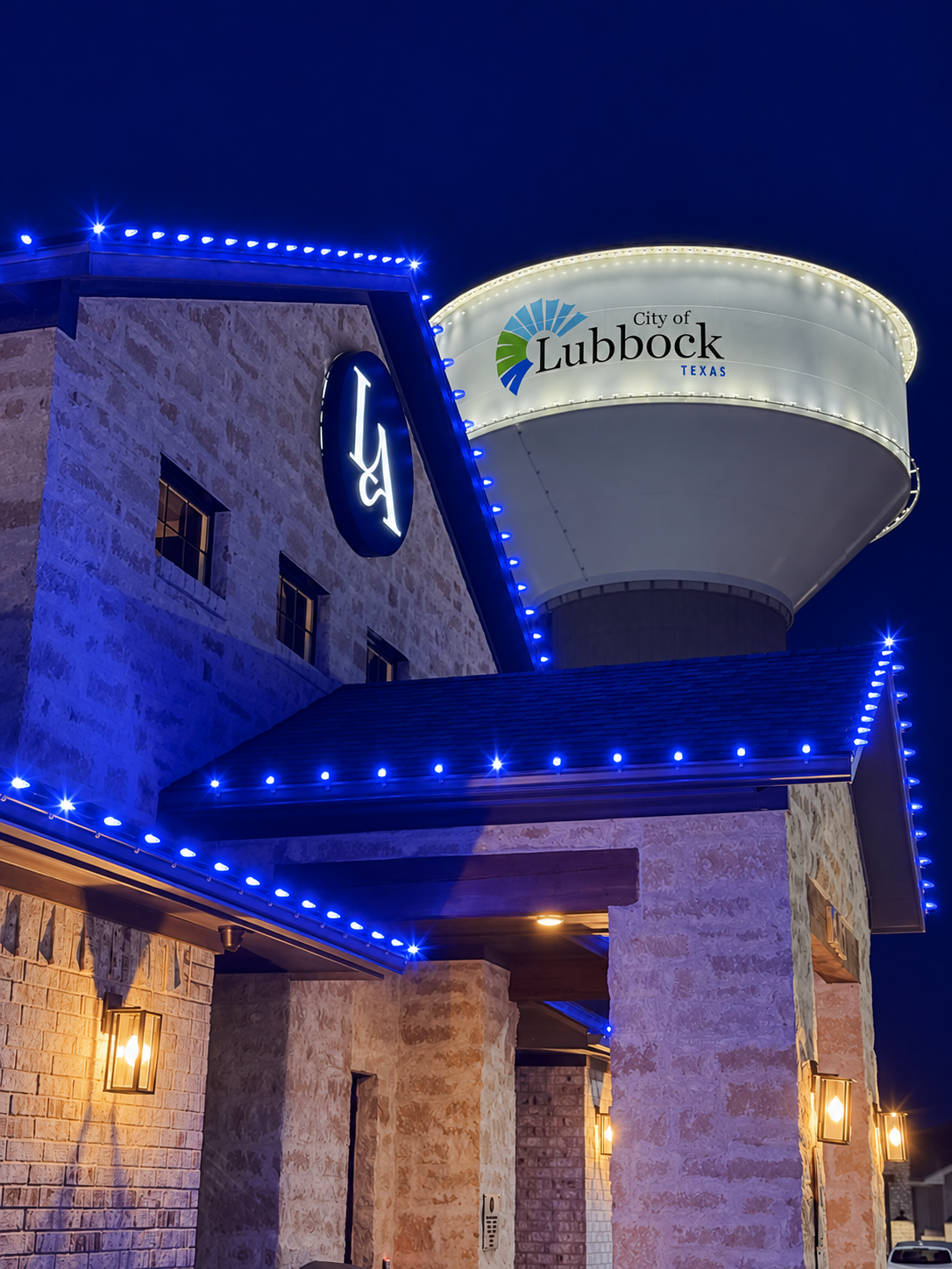 Modern commercial property entrance illuminated at night
